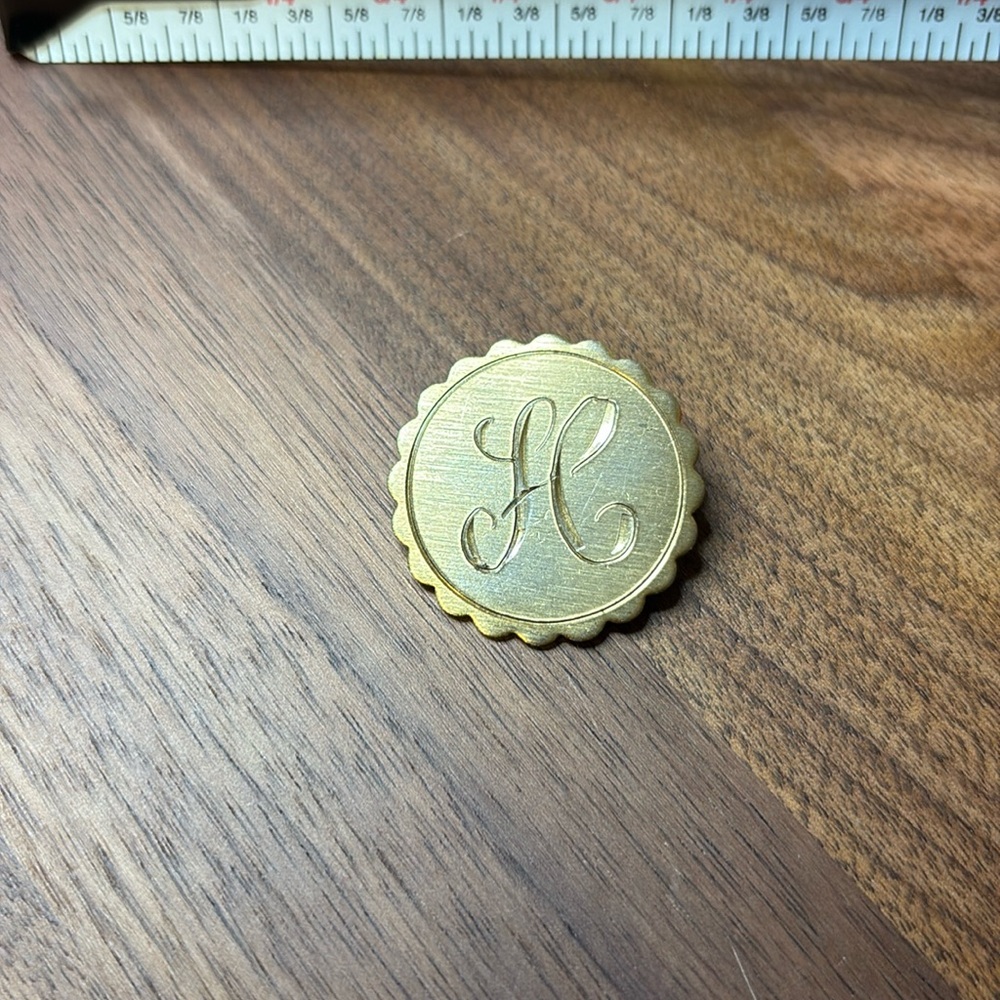 H monogram brooch